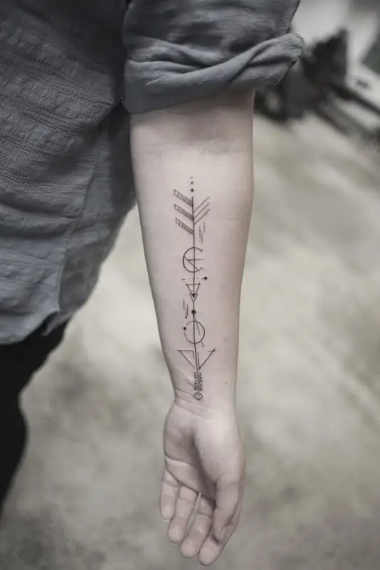 arrow and circle forearm geometric tattoo