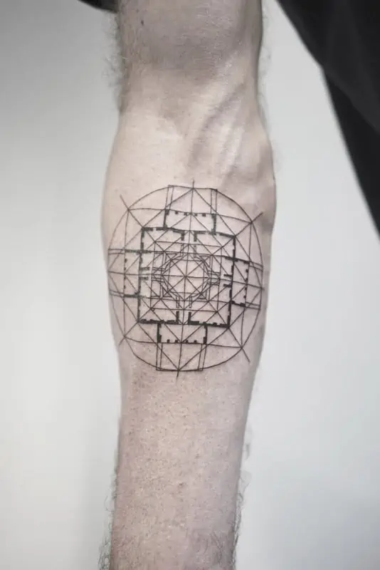 circle and cross geometric tattoo