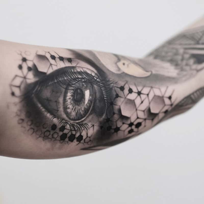 eye arm geometric tattoo