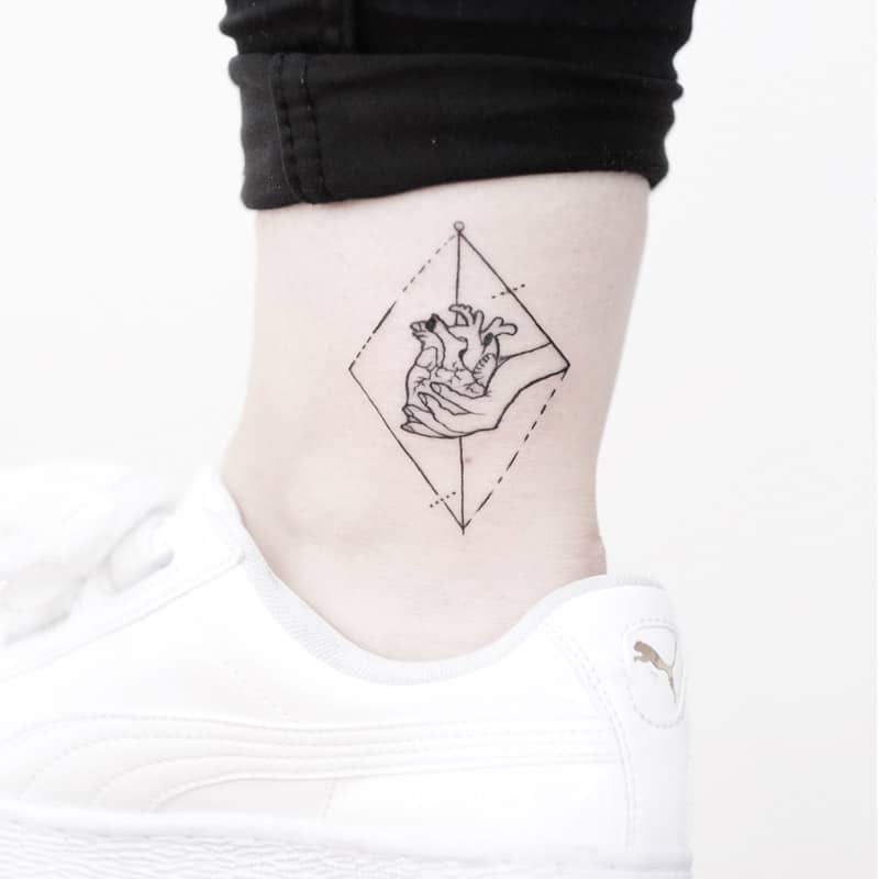 hand and heard ankle geometric tattoo