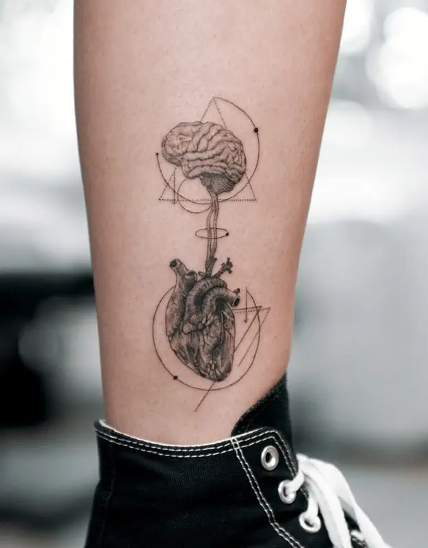 brain and heart leg geometric tattoo