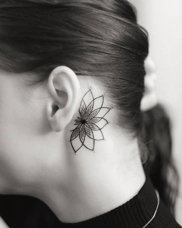 lotus ear geometric tattoo