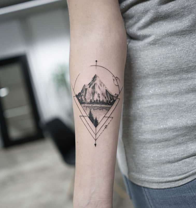 foremarm mountain with arrow geometric tattoo