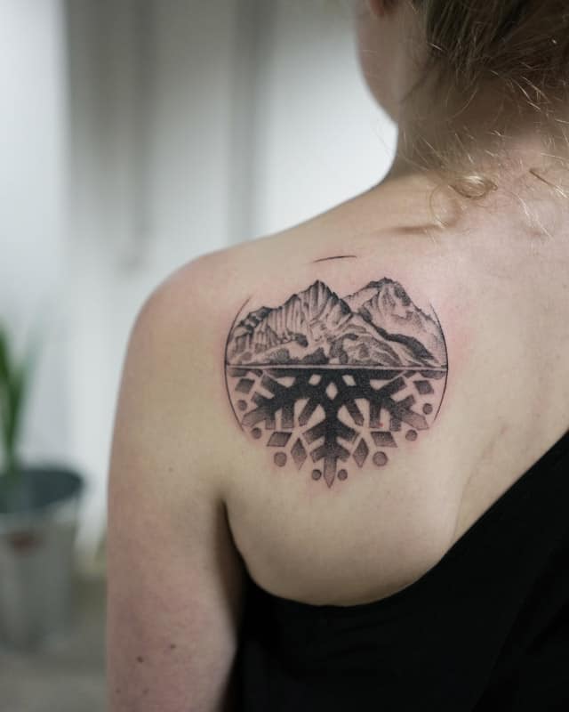 back mountain with circle geometric tattoo