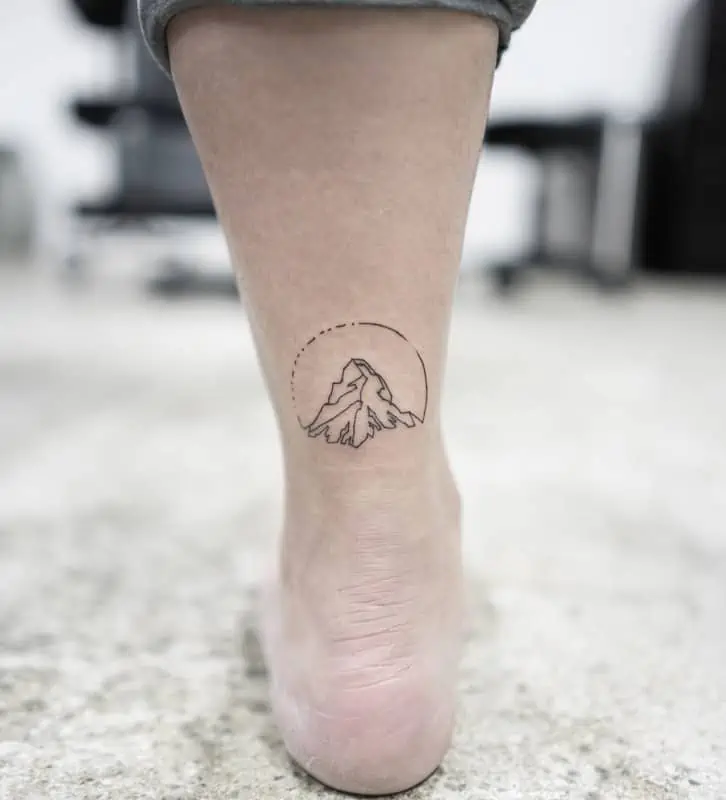 ankle mountain with circle geometric tattoo