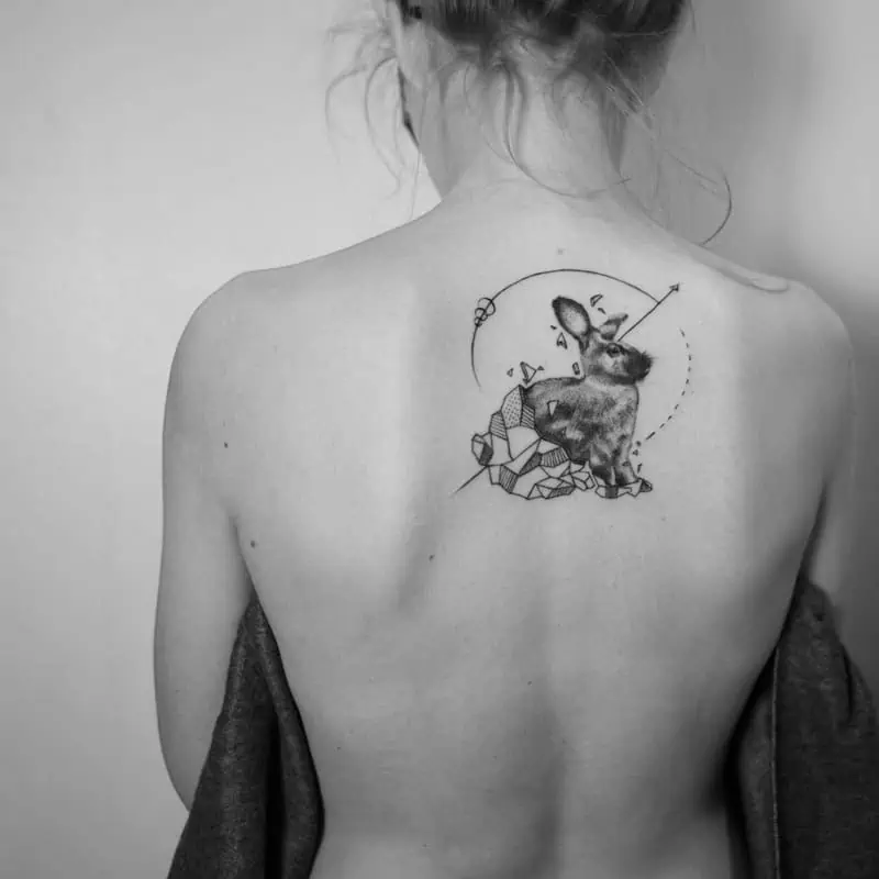 back rabbit with arrow geometric tattoo