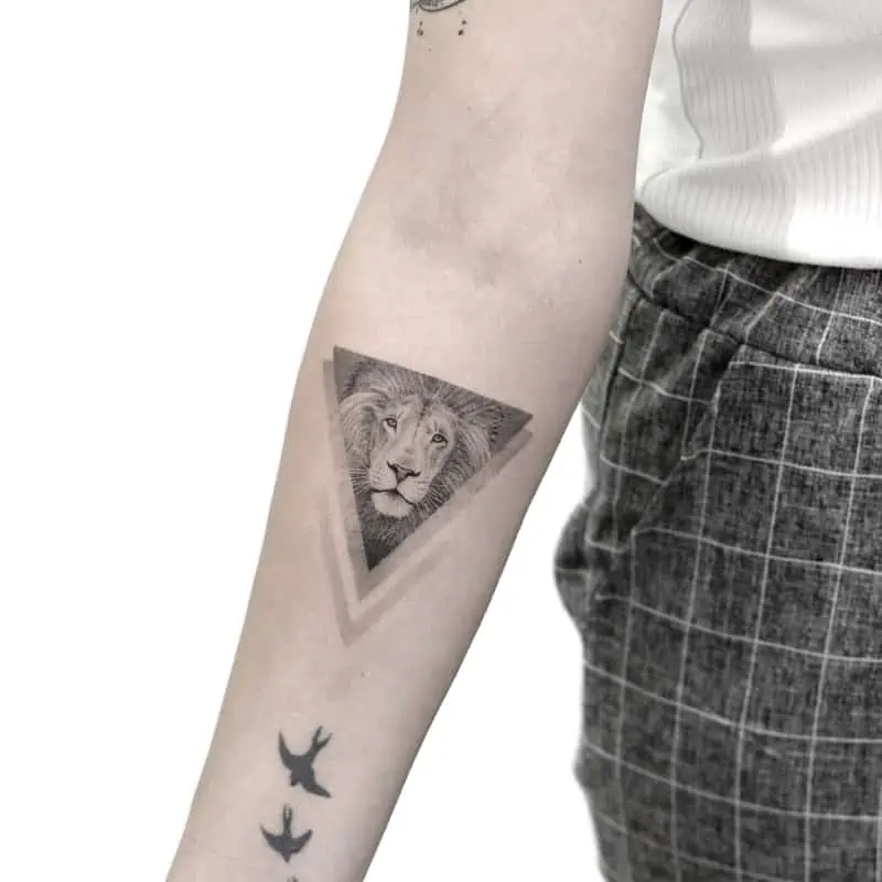 simple geometric lion tattoo