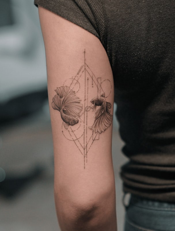 two fish triceps geometric tattoo