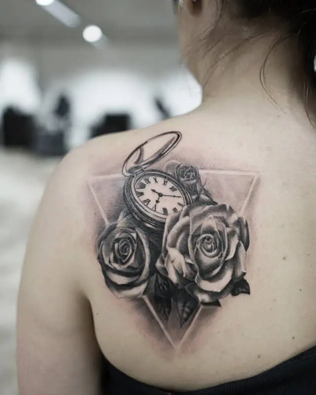 compass and roses on back tattoo