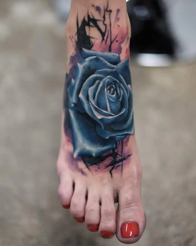 blue rose on foot tattoo realistic