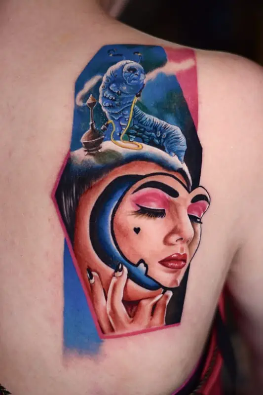 colored lady with caterpillar tattoo