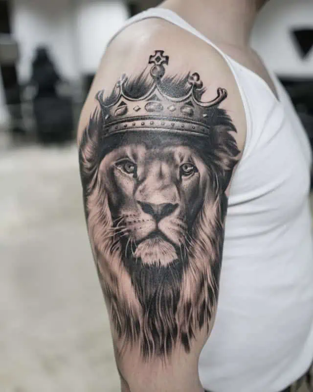 crown lion arm tattoo