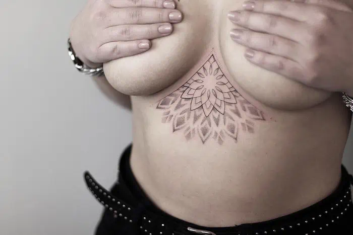 mandala lower chest tatoo